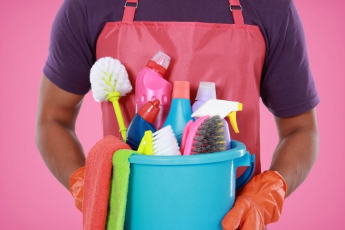 Cleaning staff tidying desks and shared office spaces in Westminster
