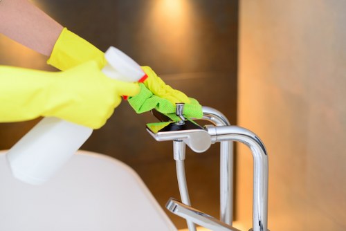 Professional oven cleaning technician working safely in a Westminster home
