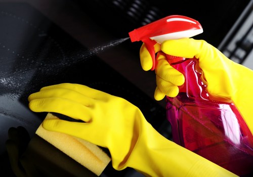 Technician wearing PPE during a Westminster oven cleaning service